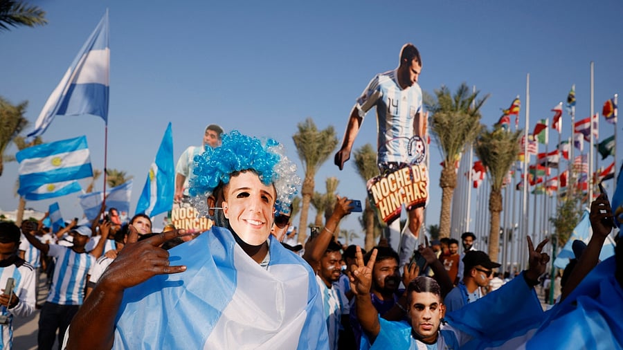 Fans of Lionel Messi, Neymar and Harry Kane converged on the Doha seafront for a march that would normally not have been allowed. Credit: Reuters Photo