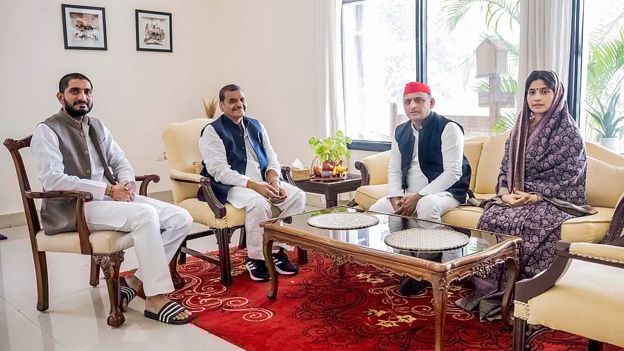 Samajwadi Party (SP) President Akhilesh Yadav and wife Dimple Yadav with Pragatisheel Samajwadi Party Lohia President Shivpal Singh Yadav and his son Aditya Yadav during a meeting, in Mainpuri, Thursday, Nov. 17, 2022. Credit: PTI Photo