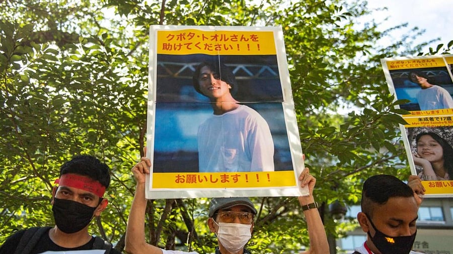 A group of activists hold placards of Japanese citizen Toru Kubota, who is detained in Myanmar, during a rally in front of the Ministry of Foreign Affairs in Tokyo. Credit: AFP File photo