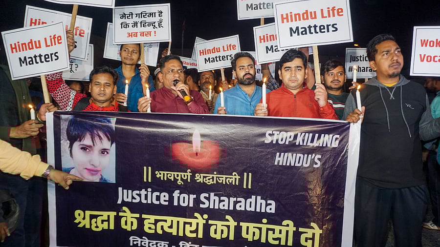 Hindu Ekta Manch activists take part in a candle light vigil over the killing of Shradha Walkar, in Mehrauli. Credit: PTI Photo