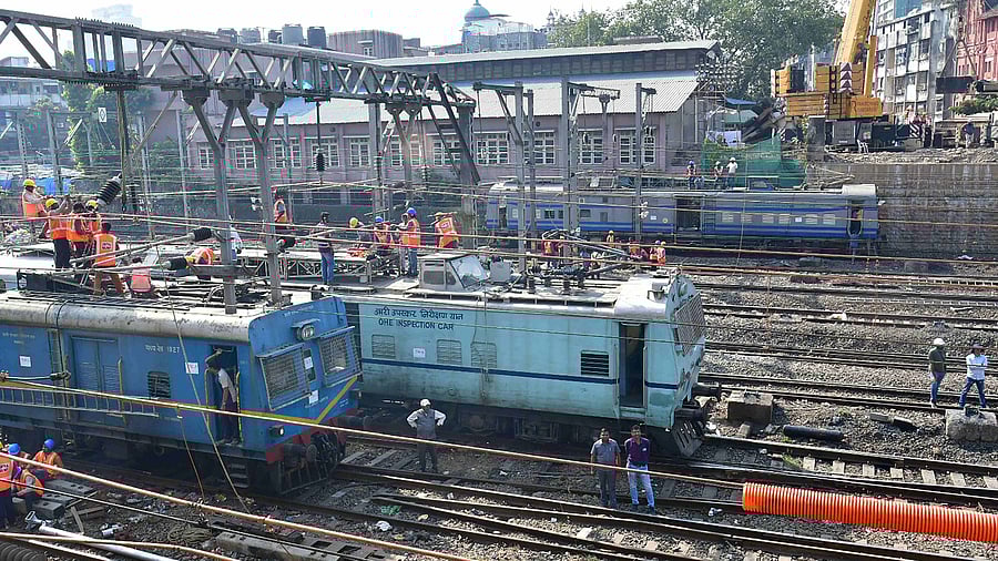 Workers dismantle British-era Carnac Bridge. Credit: PTI Photo