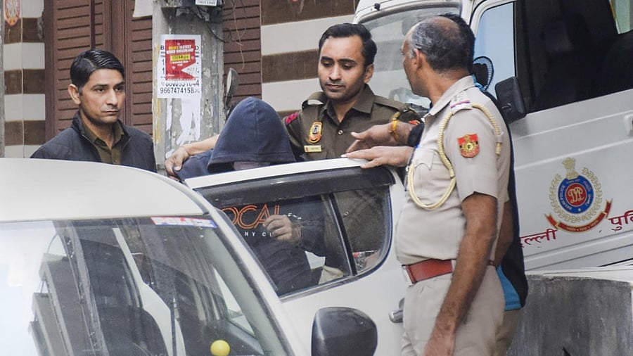 Aftab Poonawalla, accused of killing his partner Shraddha Walkar, being brought to his residence at Chhatarpur as part of the ongoing investigation. Credit: PTI Photo
