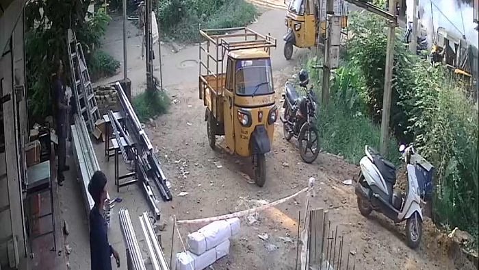 Smoke rises (on extreme right) after an autorickshaw on a street, as seen from a CCTV camera from a nearby area, in Mangaluru city. Credit: PTI Photo