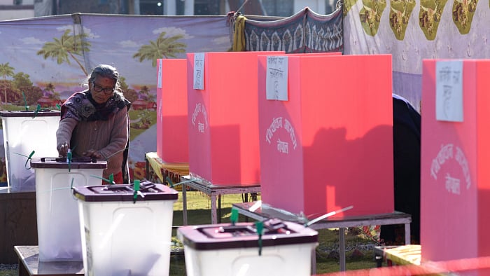 A woman casts her vote during the general election, in Lalitpur, Nepal. Credit: Reuters File Photo