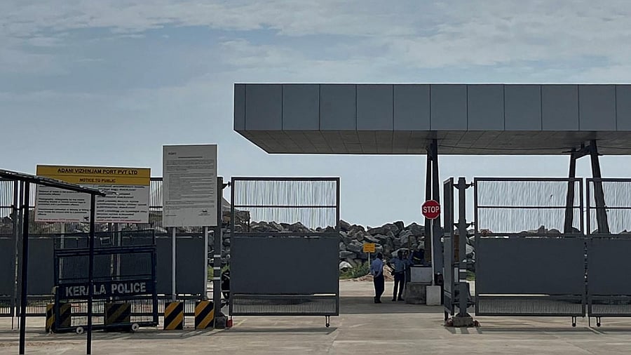 Private security guards stand near an entrance of the proposed Vizhinjam Port in Kerala. Photo credit: Reuters