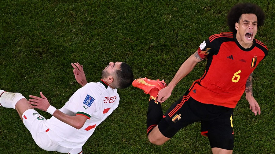 Belgium's midfielder Axel Witsel fights for the ball with Morocco's midfielder Hakim Ziyech during the Qatar 2022 World Cup Group F football match between Belgium and Morocco at the Al-Thumama Stadium in Doha. Credit: AFP Photo