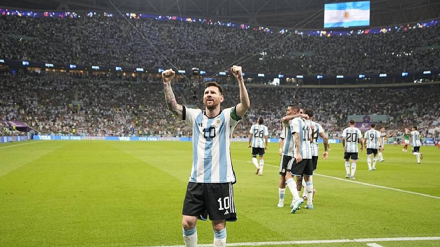 Argentina's Lionel Messi celebrates after scoring his side's opening goal during the World Cup group C soccer match between Argentina and Mexico. Credit: AP/PTI Photo