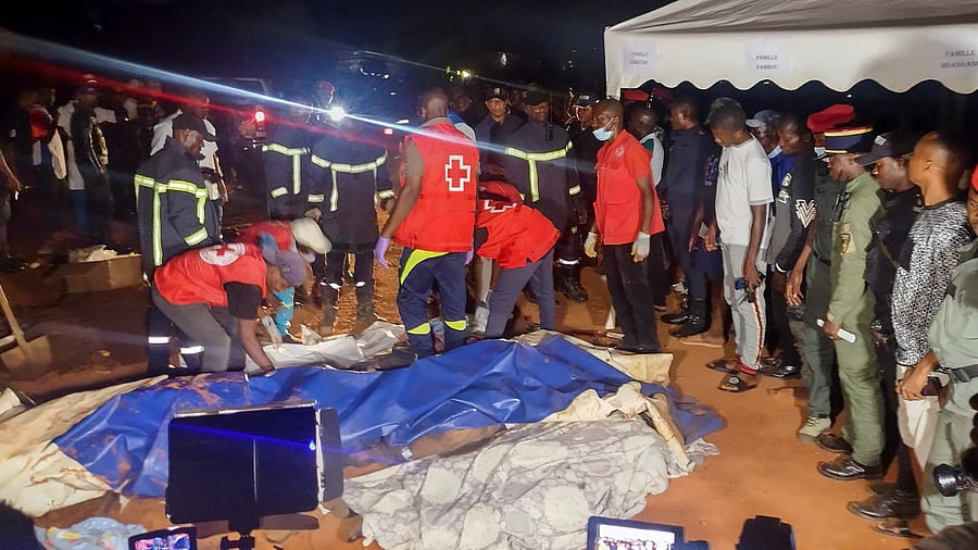 Rescuers prepare to carry a body after a landslide in Cameroon. Credit: Reuters Photo