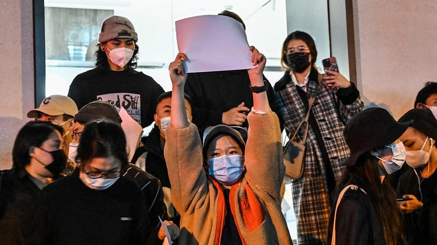 People show blank papers as a way to protest against China's zero-Covid policy in Shanghai. Credit: AFP Photo