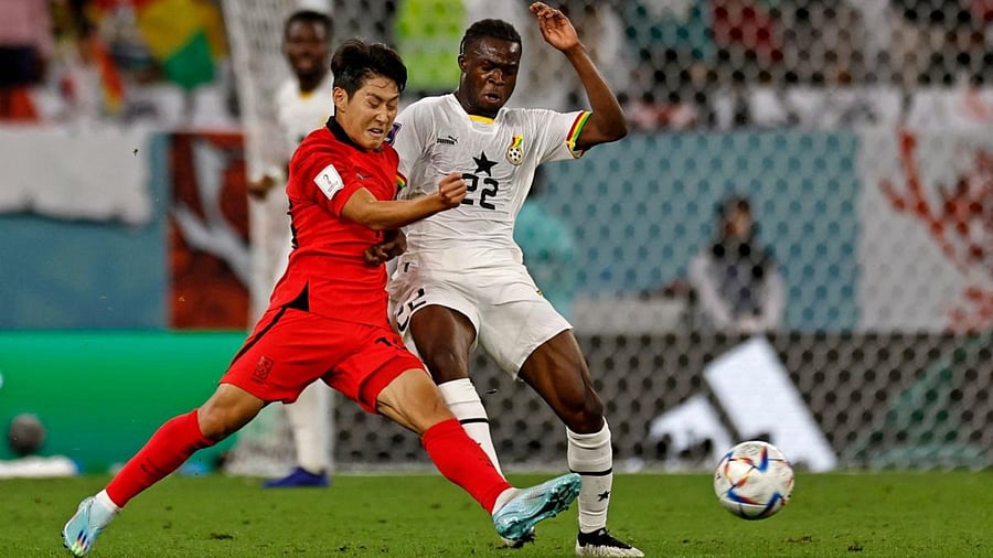 South Korea's midfielder #10 Lee Jae-sung and Ghana's forward #22 Kamaldeen Sulemana fight for the ball during the Qatar 2022 World Cup Group H football match between South Korea and Ghana at the Education City Stadium in Al-Rayyan, west of Doha, on November 28, 2022. Credit: AFP Photo