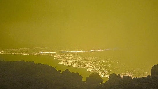 Flows of lava remained mostly contained within the summit's massive caldera, but the eruption could pose a threat to nearby residents should conditions change. Credit: AFP Photo