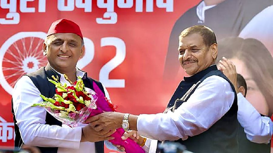 SP President Akhilesh Yadav with Pragatisheel Samajwadi Party (Lohia) leader Shivpal Singh Yadav during Mainpuri Lok Sabha bypoll campaign. Credit: PTI Photo