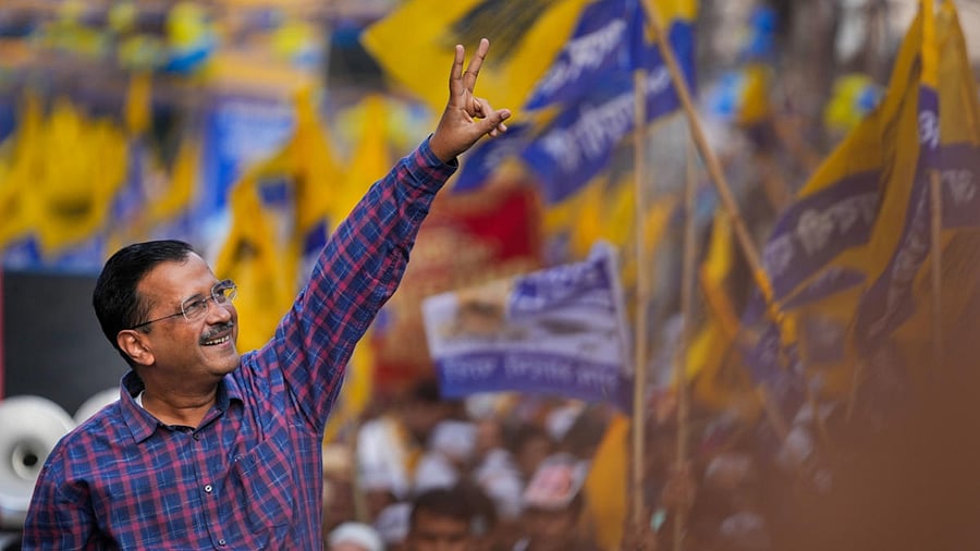 Kejriwal at AAP roadshow ahead of MCD polls. Credit: PTI Photo