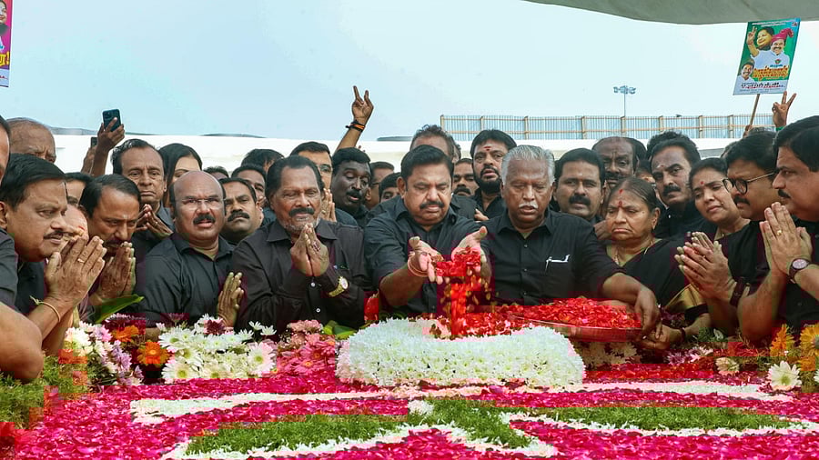 AIADMK interim General Secretary Edappadi K Palaniswami with party workers pays tribute to former Tamil Nadu chief minister J Jayalalithaa on her death anniversary, at her memorial in Chennai. Credit: PTI Photo