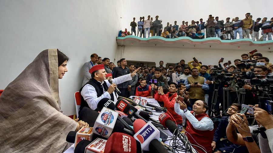 Samajwadi Party President Akhilesh Yadav with his wife and party candidate Dimple Yadav addresses a press conference after casting vote for the Mainpuri Lok Sabha seat by-elections. Credit: PTI Photo