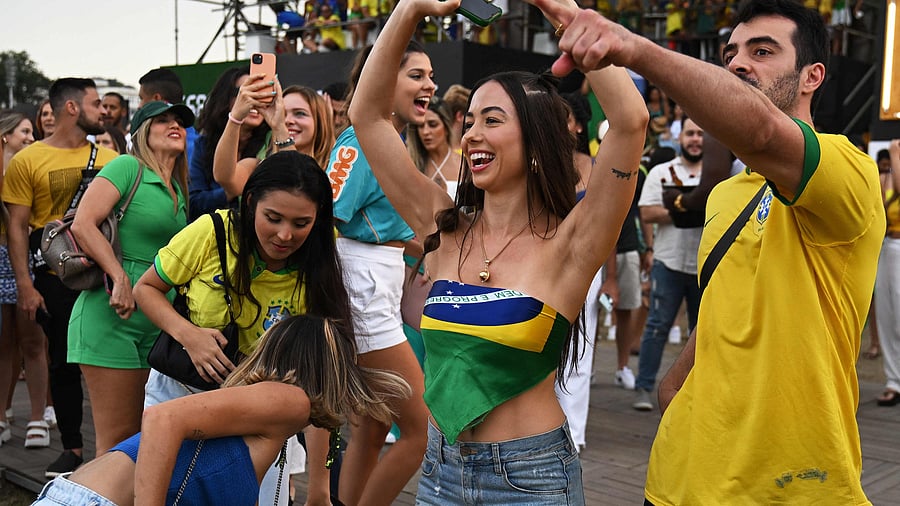 Fans of Brazil react while watching the live broadcast of the Qatar 2022 World Cup round of 16 football match between Brazil and South Korea in Rio de Janeiro, Brazil, on December 5, 2022. Credit: Reuters Photo