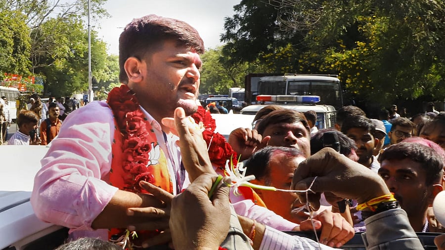 BJP candidate from Viramgam seat Hardik Patel celebrates his win with supporters. Credit: PTI Photo