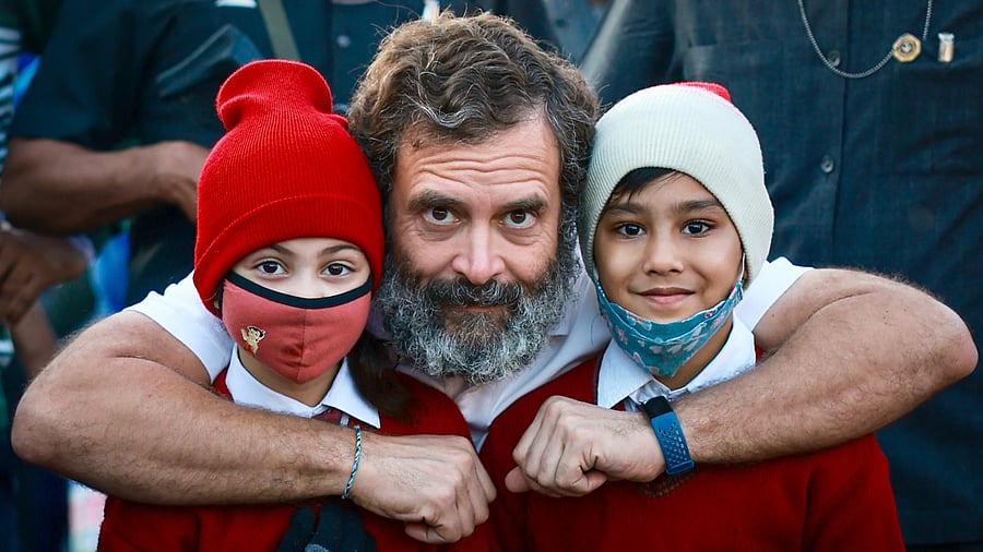 Congress leader Rahul Gandhi with young supporters during the party's Bharat Jodo Yatra, in Kota district. Credit: PTI Photo
