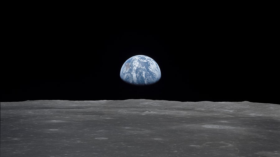 This view from the Apollo 11 spacecraft shows the Earth rising above the moon's horizon. Credit: NASA Photo