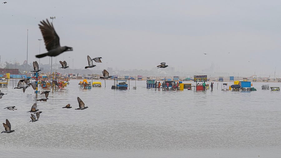 Vendors salvage their shops after some damages due to the landfall of Cyclone Mandous, at Marina beach, in Chennai, Saturday, Dec. 10, 2022. Credit: PTI Photo