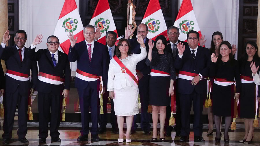 Peru's President Dina Boluarte, who took office after her predecessor Pedro Castillo was ousted, poses for a family photo along with members of her Cabinet in Lima. Credit: Reuters Photo