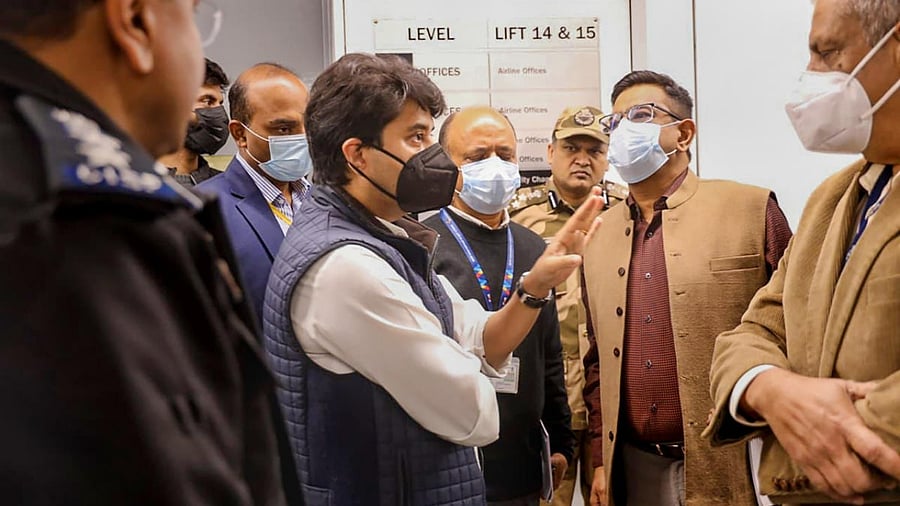 Scindia speaks to officials at Terminal 3 of the Delhi airport. Credit:PTI Photo