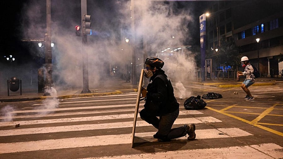 Supporters of former President Pedro Castillo clash with riot police during a protest near the Congress in Lima. Credit: AFP Photo