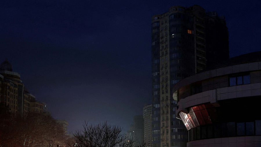 A view shows apartment buildings without electricity during a power outage after critical civil infrastructure was hit by Russian drone attacks: Credit: Reuters