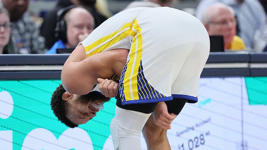 Warriors coach Steve Kerr said Curry will have an MRI exam on Thursday to determine the extent of the 34-year-old guard's injury. Credit: Getty via AFP Photo