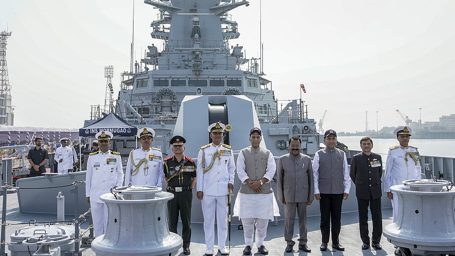 Rajnath Singh with others during during the commissioning ceremony of INS Mormugao at the naval dockyard in Mumbai. Credit: PTI Photo