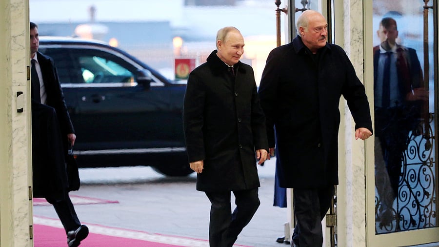 Vladimir Putin and Belarusian President Alexander Lukashenko arrive for a meeting at the Palace of Independence in Minsk, Belarus. Credit: Reuters Photo