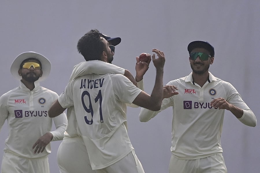 Jaydev Unadkat (C) celebrates with teammates after the dismissal of Bangladesh's Zakir Hasan during the first day of the second cricket Test match between Bangladesh and India. Credit: AFP Photo