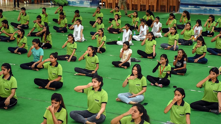 Students participate in a yoga session in Kota. Credit: PTI Photo