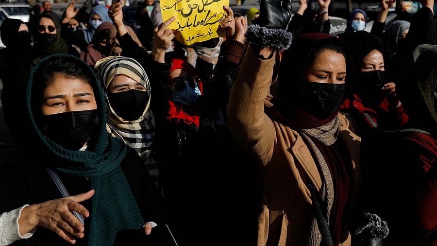 Afghan women chant slogans in protest against the closure of universities to women by the Taliban. Credit: Reuters Photo