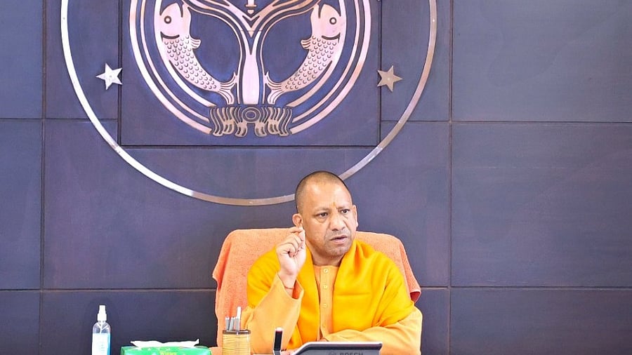 Uttar Pradesh CM Yogi Adityanath chairs a meeting with Team-9 officials over Covid-19 situation. Credit: IANS Photo