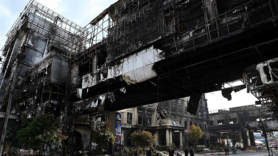 Military Police walk through a burned out part of the Grand Diamond City hotel-casino following a major fire at the complex in Poipet, in Banteay Meanchey province on December 31, 2022. Credit: AFP File Photo