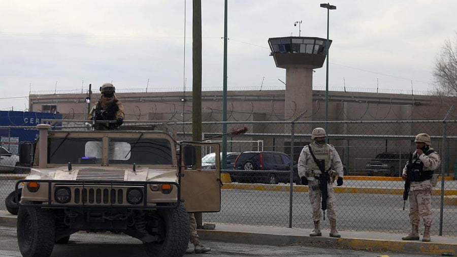Members of the Mexican Army secure an area outside the prison of Ciudad Juarez number 3 after an attack in Ciudad Juarez, Chihuahua state. Credit: AFP Photo