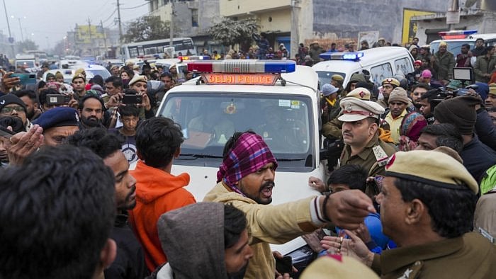 Body of the 20-year-old woman, who was killed after being hit and dragged by a car, being taken for cremation from her residence, at Karan Vihar area of Sultanpuri. Credit: PTI Photo
