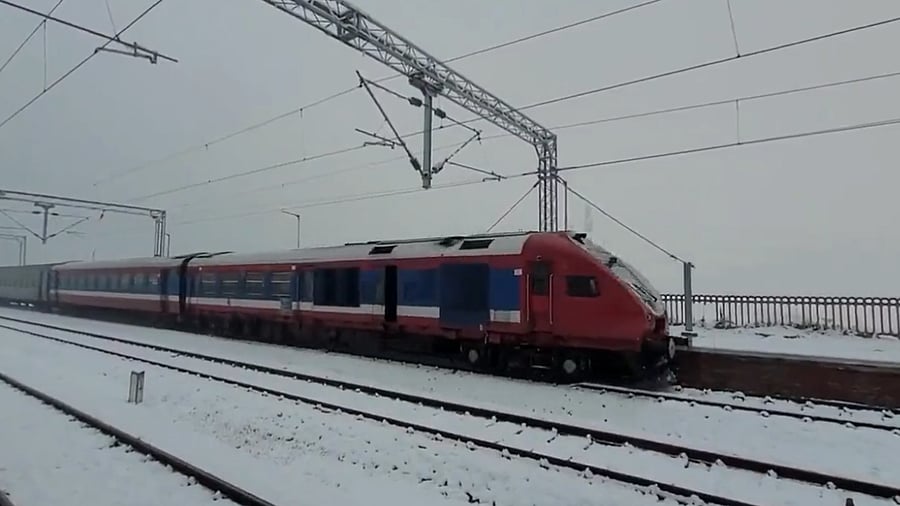 A panoramic view of a train passing through a snow-laden valley from Banihal to Budgam in Jammu and Kashmir. Credit: Twitter/@raosahebdanve