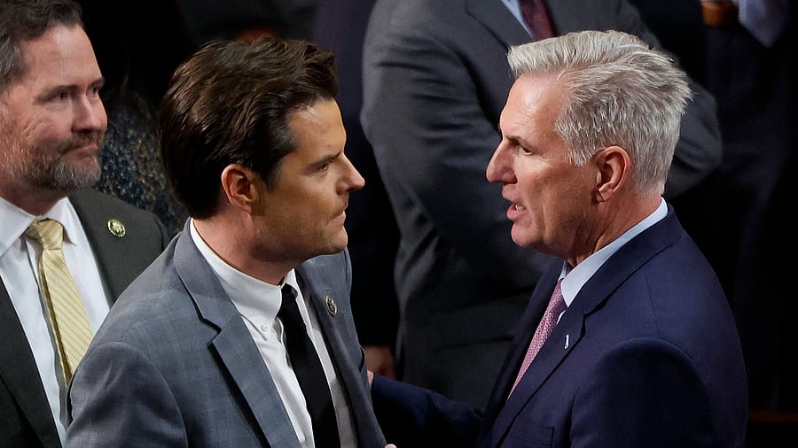 US House Republican Leader Kevin McCarthy (R-CA) (R) talks to Rep.-elect Matt Gaetz (R-FL) in the House Chamber. Credit: AFP Photo