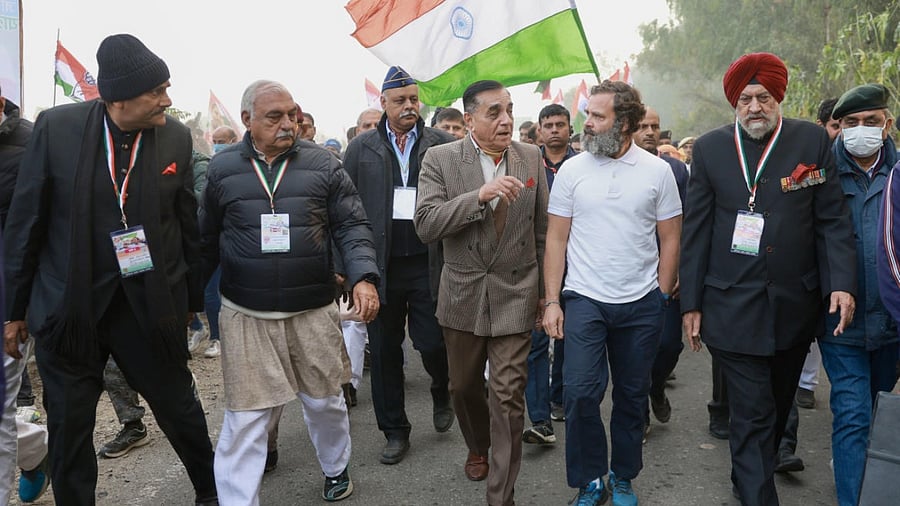 Rahul Gandhi with party leader Bhupinder Singh Hooda, ex-COAS Gen Deepak Kapoor and others during the party's 'Bharat Jodo Yatra', in Kurukshetra. credit: PTI Photo