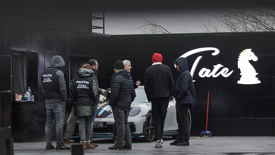 Romanian officials transport the cars seized from Andrew Tate's compound to a storage location. Credit: Reuters Photo
