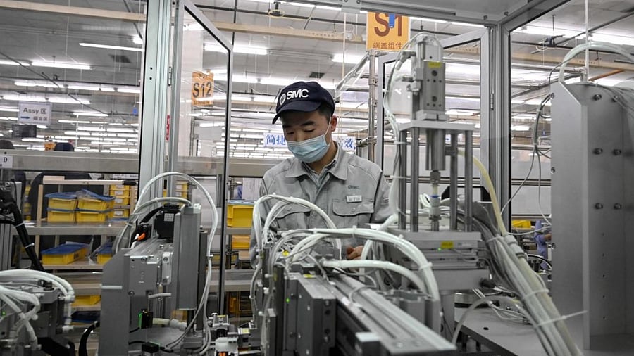 A worker seen at a Chinese factory in Beijing. Credit: AFP File Photo