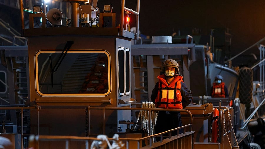A navy officer stands on board the amphibious warfare ship Yu Shan aduring the two-day routine drill by Taiwan's armed forces to show combat readiness ahead of Lunar New Year holidays, at a military base in Kaohsiung, Taiwan. Credit: Reuters photo