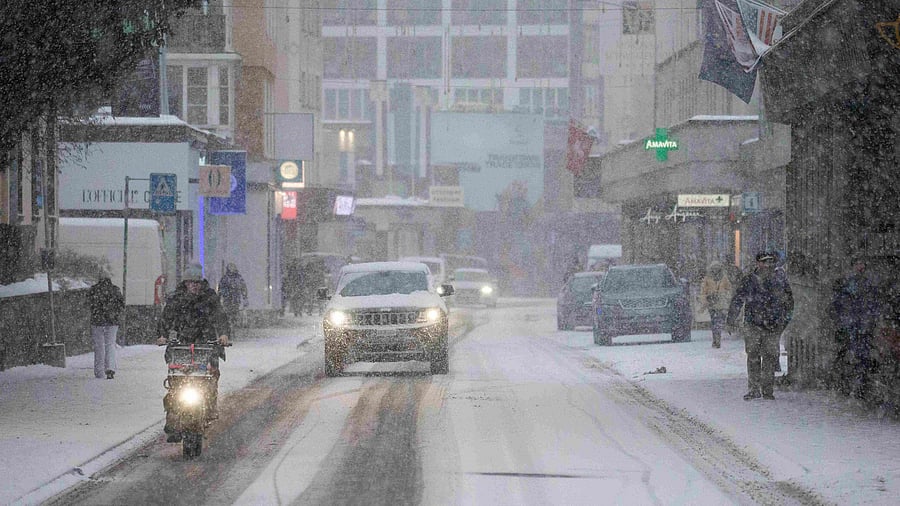 Davos does not have the same idyllic Alpine village vibe as neighboring towns. Nonetheless, it is surrounded by grand mountain peaks and forestland. Credit: Reuters Photo 