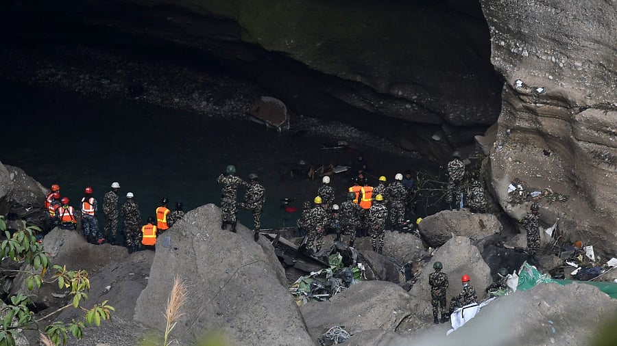 Rescue teams search for victims at the site of the Yeti Airlines plane crash, in Pokhara on January 17, 2023. Credit: AFP Photo