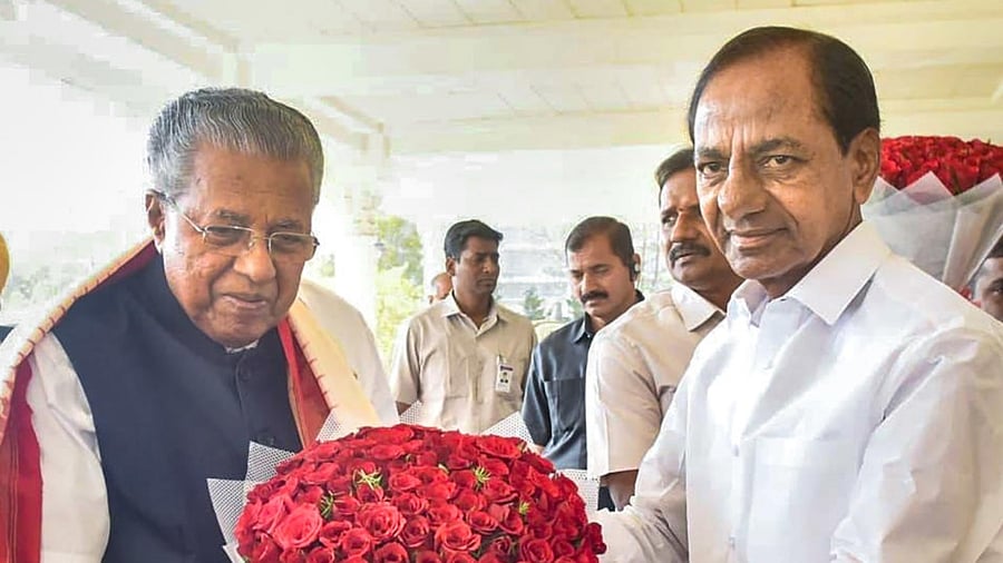 Telangana Chief Minister K Chandrashekar Rao welcomes Kerala CM P Viajayan for the BRS (Bharat Rashtra Samithi) party's rally. Credit: PTI Photo
