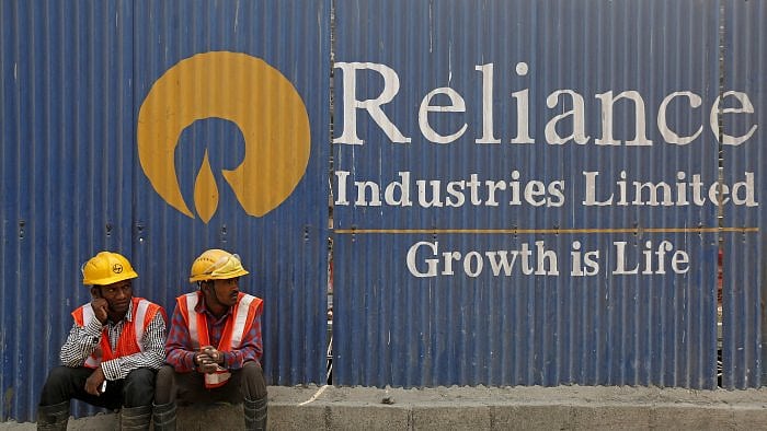 Reliance net falls 15%; plans to raise Rs 20,000 crore