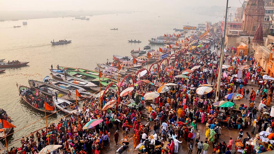 Hindu devotees take holy dip in River Ganga on the occasion of 'Mauni Amavasya' in Varanasi. Credit: PTI Photo