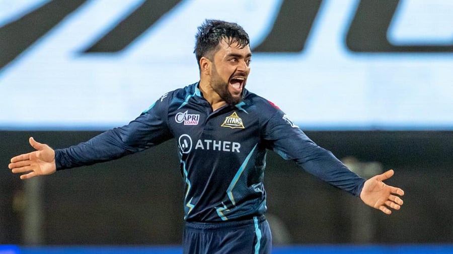 Rashid Khan of Gujarat Titans celebrates the wicket of Deepak Hooda of Lucknow Super Giants, during the Indian Premier League 2022 cricket match between Lucknow Super Giants and Gujarat Titans, at the MCA International Stadium in Pune, Tuesday, May 10, 2022. Credit: PTI File Photo